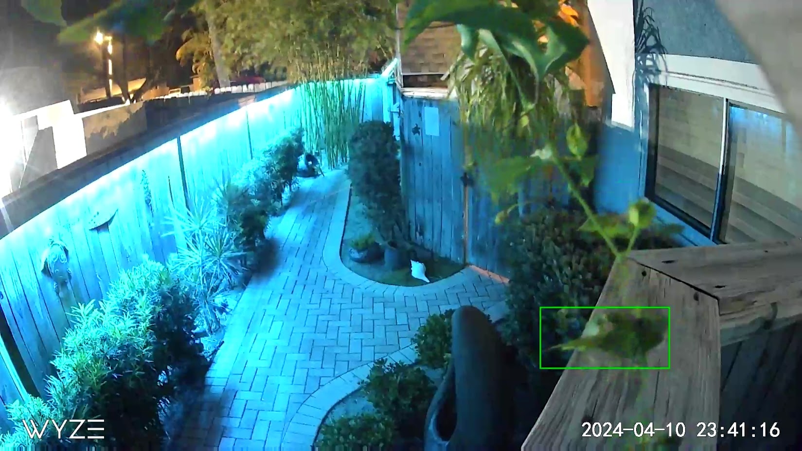 Nighttime side-yard and walkway camera coverage from a Cocoa Beach townhome